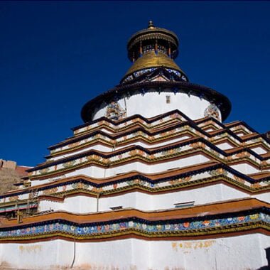 The towering Kumbu Stupa at Palcho Monastery, intricately decorated with Buddhist symbols.