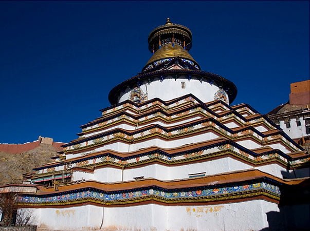 The towering Kumbu Stupa at Palcho Monastery, intricately decorated with Buddhist symbols.