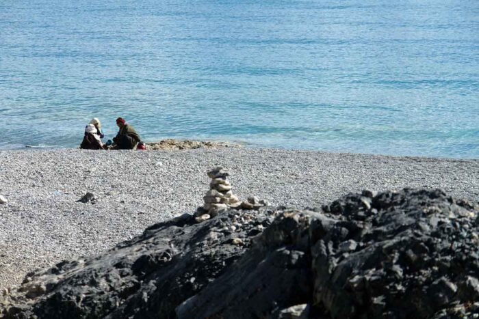 A Tibetan family on pilgrimage taking rest at Lake Manasarovar