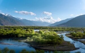 Scenic view of the Nyang River valley during Tibet’s Peach Blossom Festival, captured while driving along the riverside.